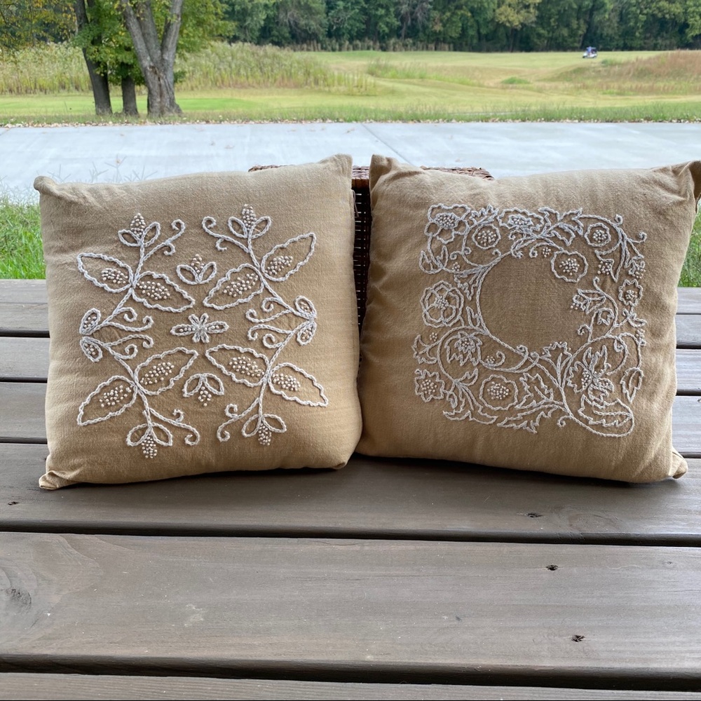 Two vintage embroidered pillows